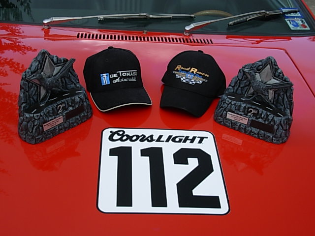 Trophies and hats on the hood